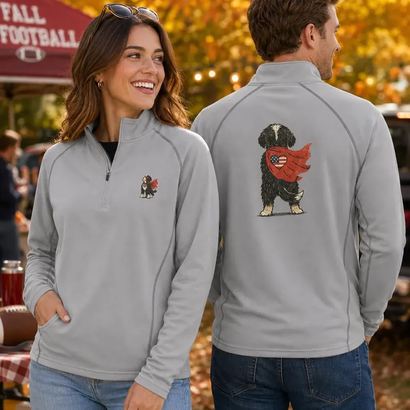 Grey quarter-zip pullovers with a small caped Bernedoodle on the chest and a large one on the back